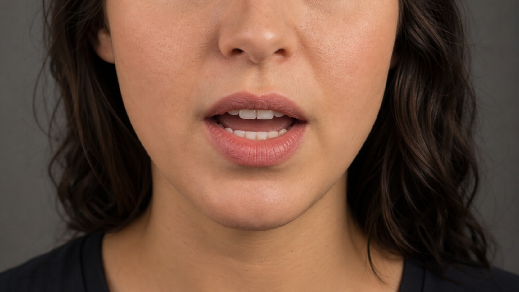 Close-up of a speaker mouth shaped for visible mouth movement in lip sync translation